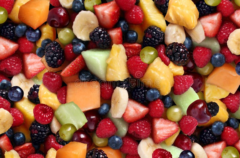Fruit salad background featuring fresh berries and cut fruits as as blueberry blackberry green strawberries melon cantaloupe raspberry pineapple banana and grapes as a symbol of healthy lifestyle eating and living well through natural nutrition.