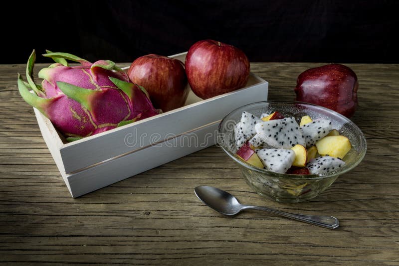 Fruit salad in a bowl on the wooden table. stock image
