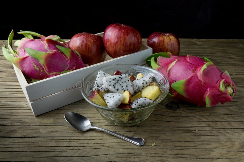 Fruit salad in a bowl on the wooden table. Selective focus. stock image