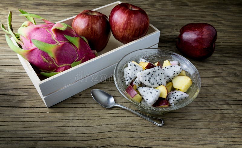 Fruit salad in a bowl on the wooden table. Selective focus. stock photo