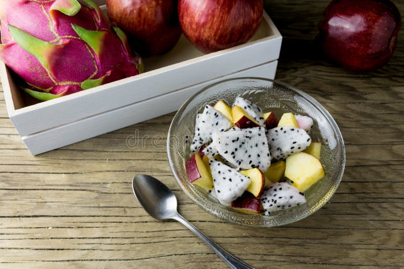 Fruit salad in a bowl on the wooden table. Selective focus. royalty free stock photos
