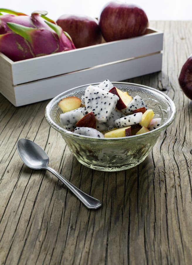 Fruit salad in a bowl on the wooden table. Selective focus. stock photo