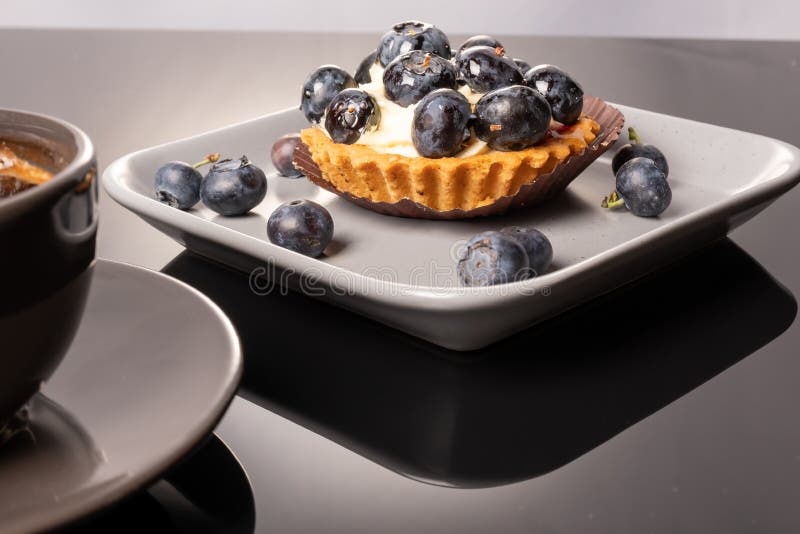 Fruit Tartlet on a Plate and Cup of Coffee on the Table, Fruit Baked