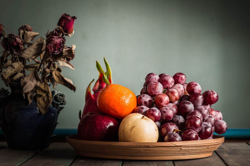 Fruit Tray and Vase of Flowers. Stock Photo Image of green, mixed