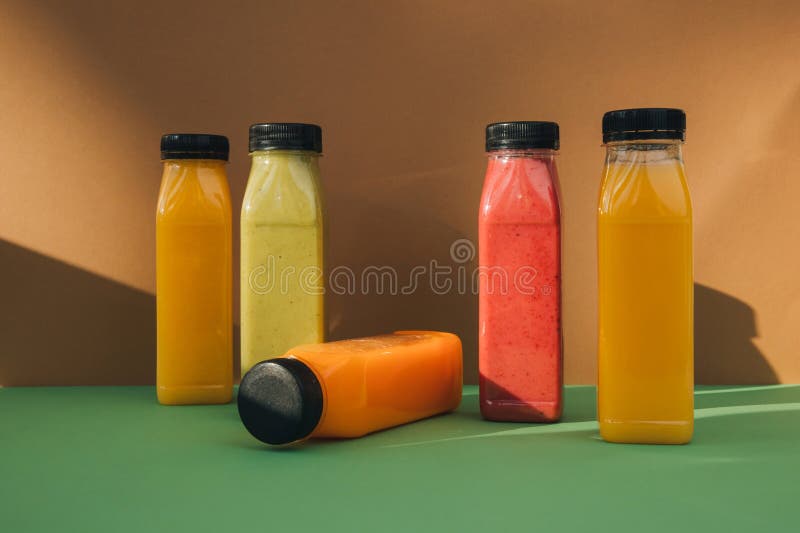 Fruit and Vegetable Smoothies in Transparent Plastic Bottles. Red ...