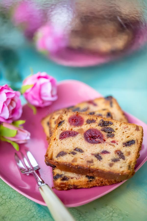 Fruitcake or cupcake on a pink plate.