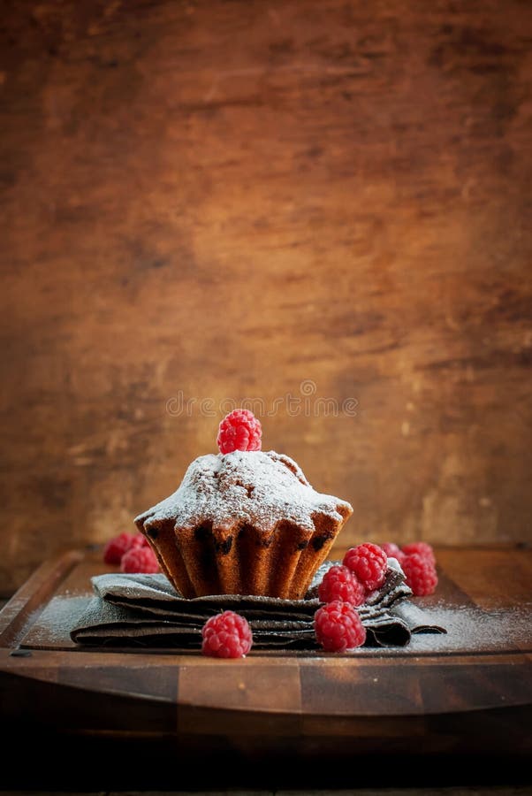 Fruitcake Decorated with Raspberry, vertical