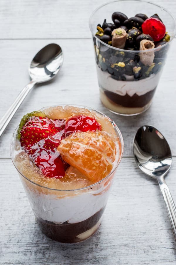 Fruits and Chocolate Chips Parfait with Yogurt in Glass Cup Stock Photo
