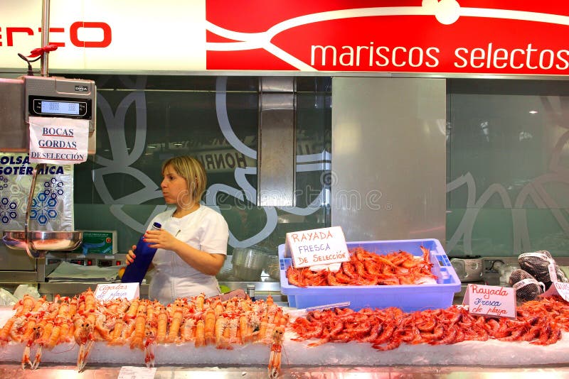 Delicious fresh Spanish seafood and crayfish at the indoor market in Valencia, Spain. This market is called the Mercado Central and is built in Art Nouveau style. A famous tourist attraction. Delicious fresh Spanish seafood and crayfish at the indoor market in Valencia, Spain. This market is called the Mercado Central and is built in Art Nouveau style. A famous tourist attraction