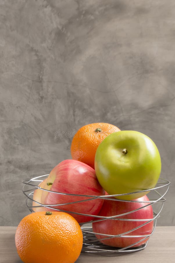 Fruits in a Decoratively Wire Basket Put on Counter Table. Stock Photo Image of full, counter