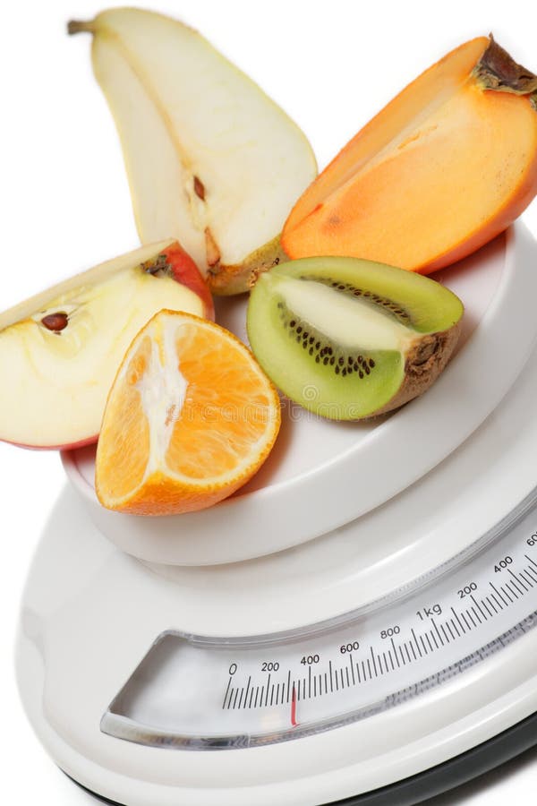 Fruits on kitchen scales stock photo. Image of gramme 7489312
