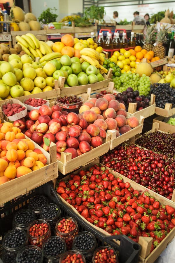 Various fresh fruits in boxes on the market. Raspberry basket stock images, royalty-free photos and pictures