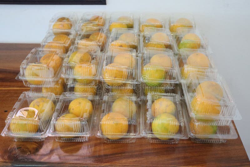 Fruits, Oranges, Packed in a Clear Plastic Box Bulk Ready To Eat. Stock