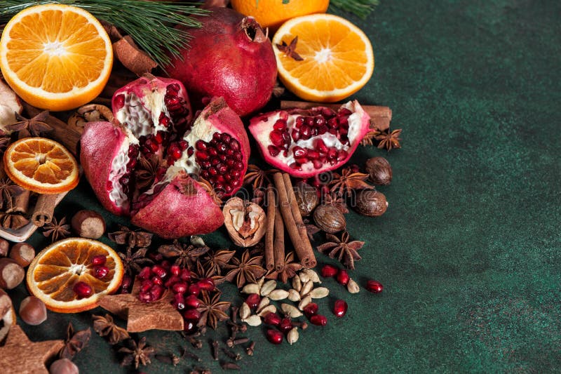 Fruits pomegranate orange spices cinnamon anise cardamon nutmeg