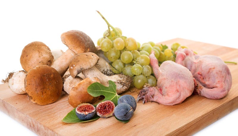 Fruits, quail and boletus edulis royalty free stock photo