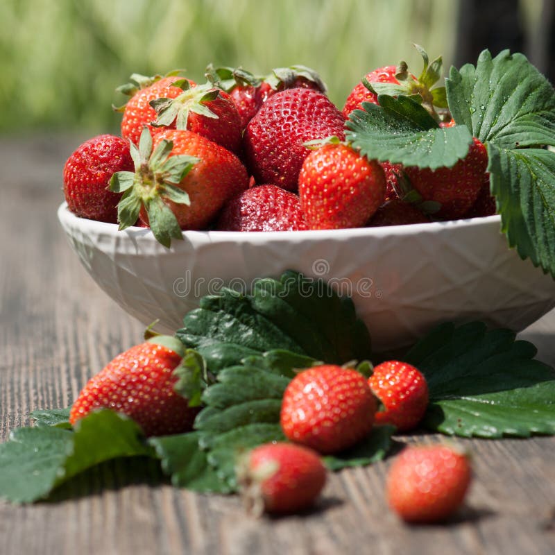 Tasty summer fruits on a wooden table. close up. Tasty summer fruits on a wooden table. close up