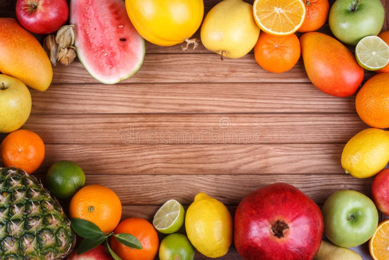 Fruits on Wood Texture Background with Space for Text. Stock Image