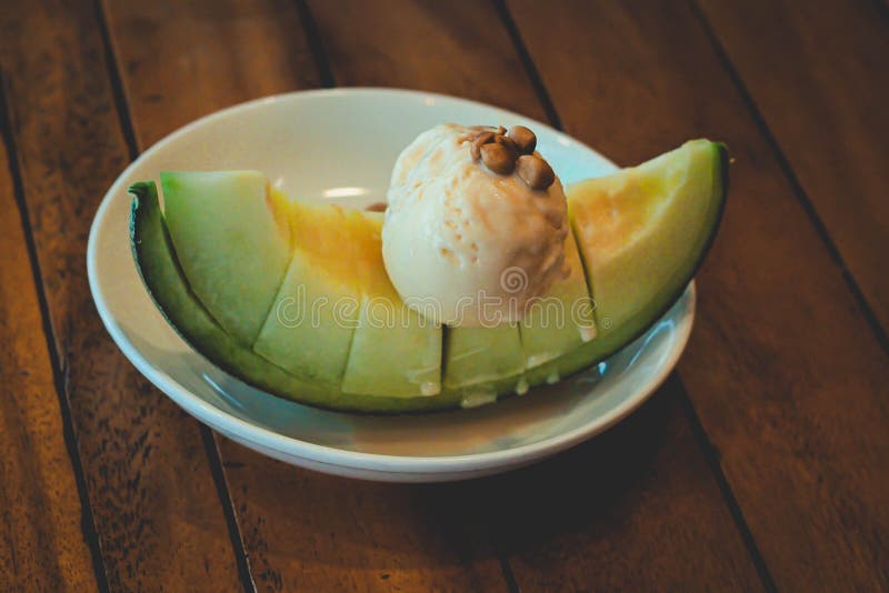 Fruity Melon Dessert, Topped with Vanilla Ice Cream Stock Photo Image