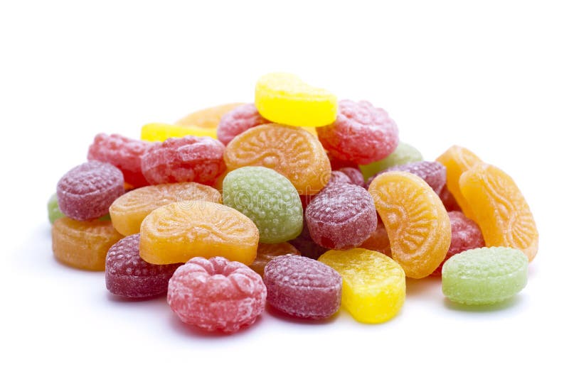 A heap of fruit sugars on white background. A heap of fruit sugars on white background.