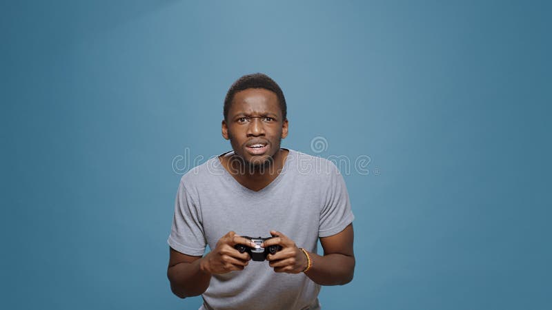 Premium Photo  Man feeling disapointed about losing video games on  computer. gamer with headphones using controller and playing online games  on monitor. sad player lost cyber game competition.
