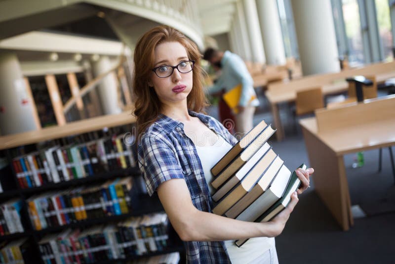 Frustrated teen student girl with books