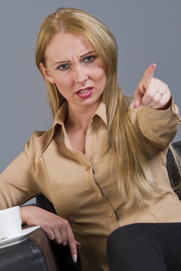 Frustrated woman pointing with finger