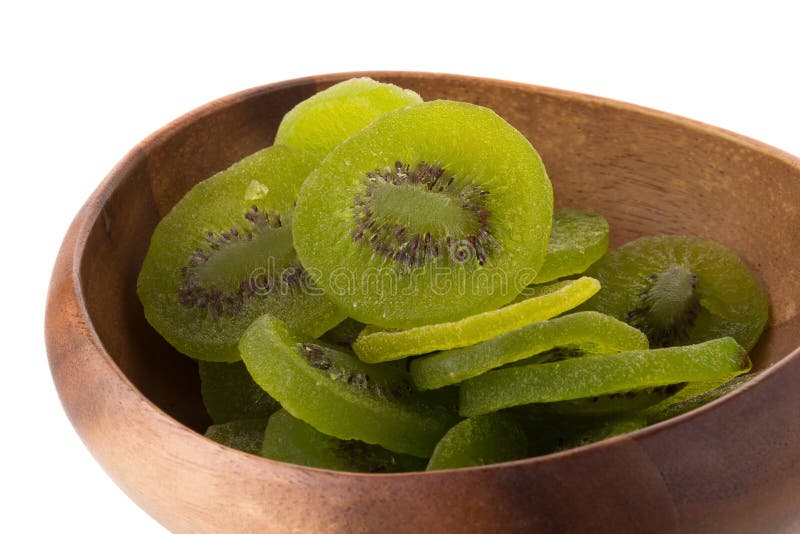 Fruta de kiwi secada en el cuenco de madera, kiwifru escarchado preservado secado imagen de archivo libre de regalías Fruta de kiwi secada en el cuenco de madera, kiwifru escarchado preservado secado imagen de archivo libre de regalías