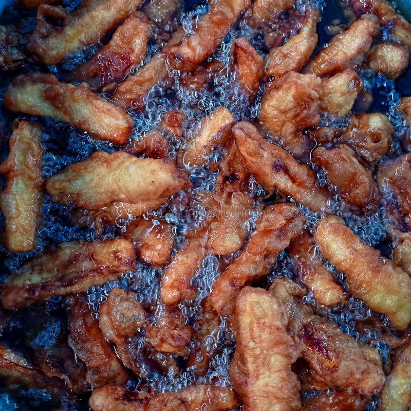 Frying bananas in hot oil stock photo. Image of delicious 226775186