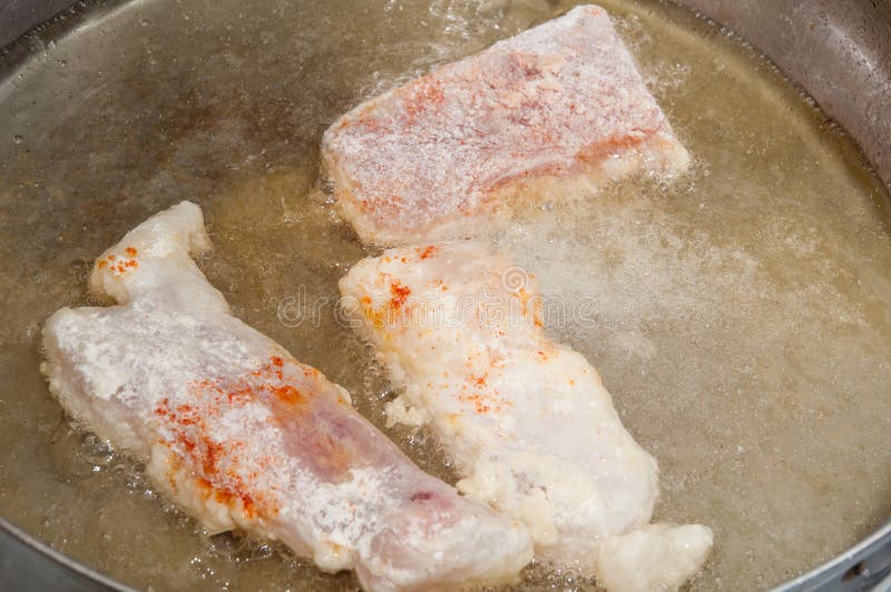 Frying Fish Rolled in Flour and Pepper in Hot Oil Stock Image Image