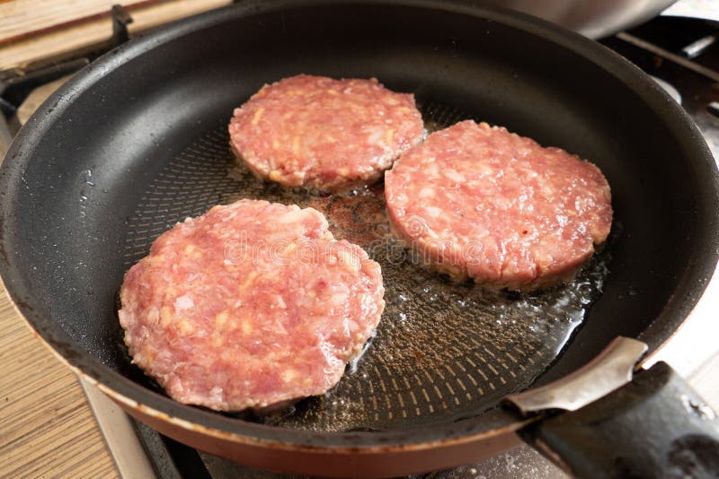 Frying hamburger cutlets stock photo. Image of food 195846618