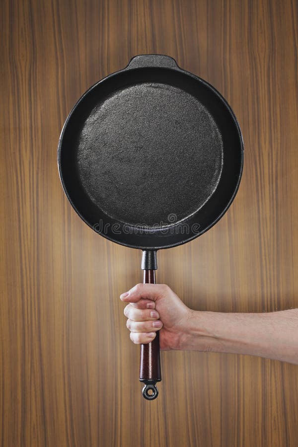 An old-fashioned cast iron frying pan. Frying pan stock images, royalty-free photos and pictures