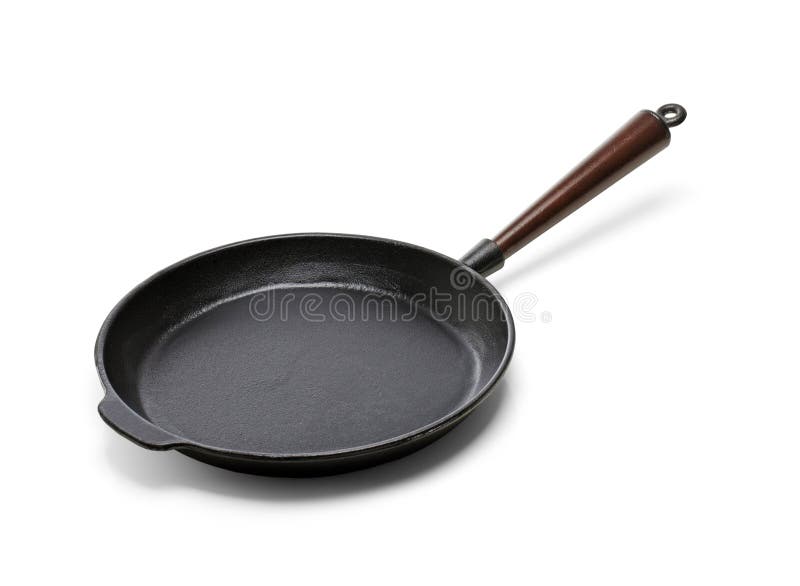 A Traditional cast iron frying pan isolated on white with natural shadows. Frying pan stock images, royalty-free photos and pictures