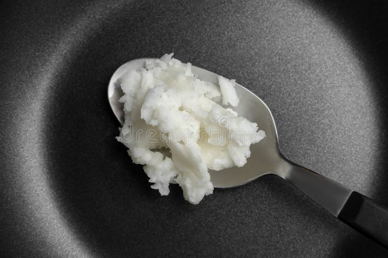 Frying Pan with Coconut Oil and Spoon, Closeup Stock Photo Image of