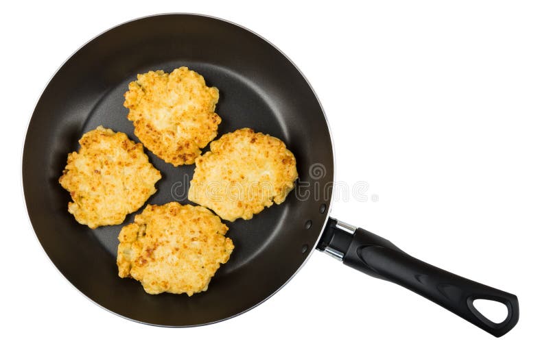 Frying pan with cottage cheese pancakes isolated on white background