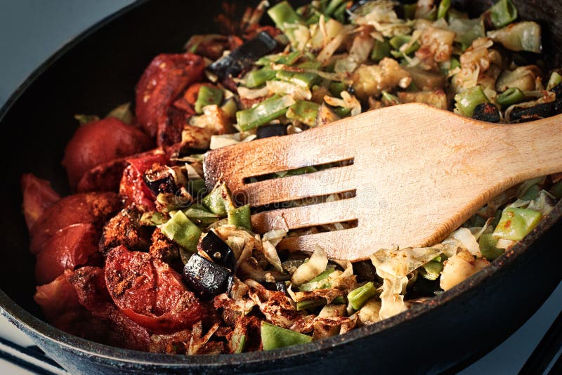 Frying pan full of vegetables on the stove. Frying pan stock images, royalty-free photos and pictures