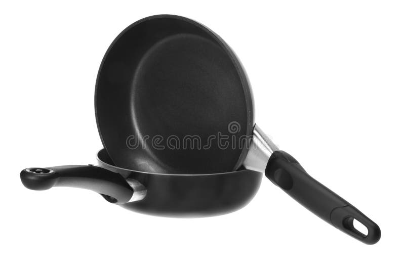 Frying Pans on a Campfire at a Campsite. Steaks are Grilled Over a Fire