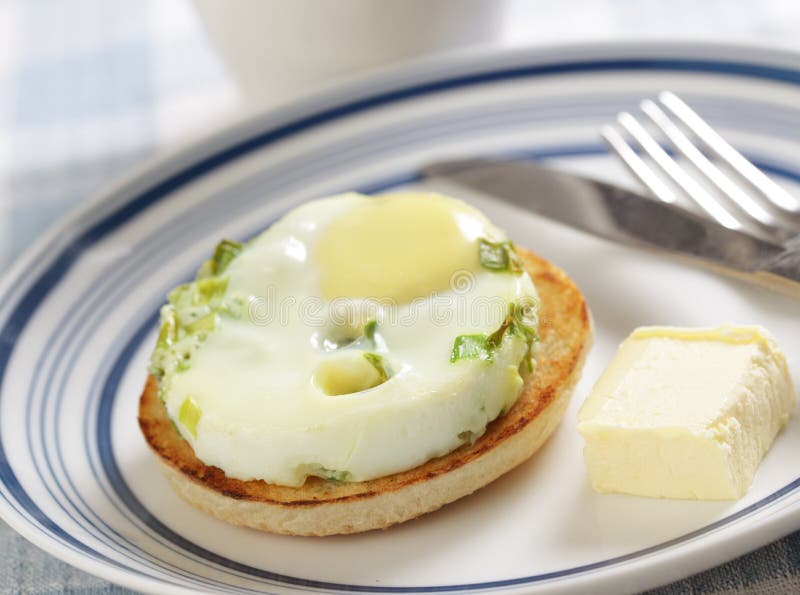 Breakfast with baked eggs on the toasted bun. Breakfast with baked eggs on the toasted bun