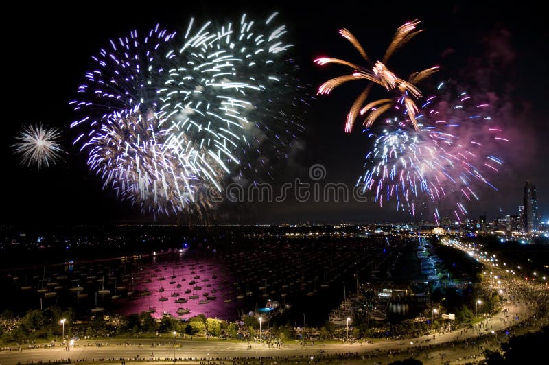 Night time aerial view of downtown Chicago lakefront during independence day fireworks. Night time aerial view of downtown Chicago lakefront during independence day fireworks