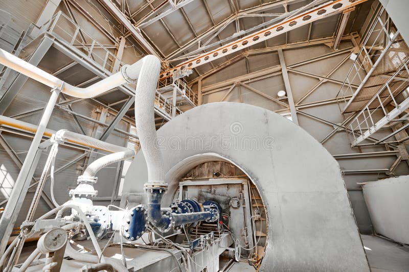 Fuel burning device of tubular rotary furnace at calx plant. Operating equipment of contemporary limestone manufacturing industrial complex