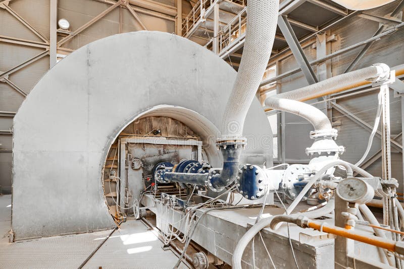 Fuel burning device of tubular rotary furnace at calx plant. Operating equipment of contemporary limestone manufacturing industrial complex