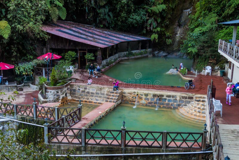 FUENTES GEORGINAS, GUATEMALA - MARCH 22, 2016: People bathing in a thermal pool Funtes Georgina