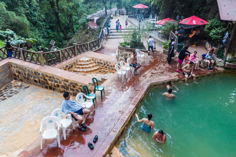 FUENTES GEORGINAS, GUATEMALA - MARCH 21, 2016: People bathing in a thermal pool Funtes Georgina