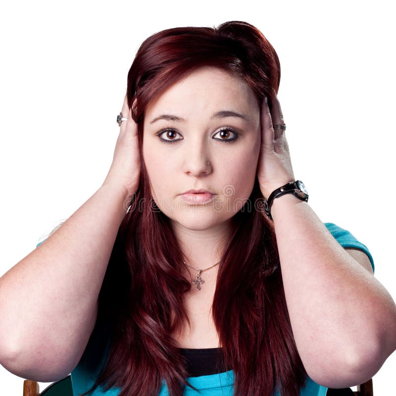 Woman covers her ears, isolated studio image. Woman covers her ears, isolated studio image