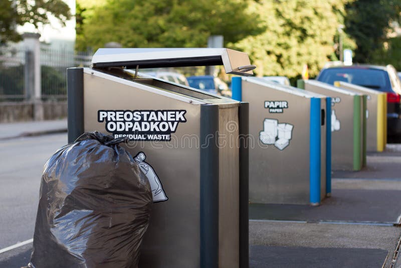 Trash bin and black garbage bag Stock Photo by ©smuayc 31845137