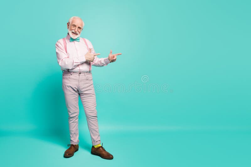 Full body photo of cool look grandpa indicate fingers empty space offer black friday prices wear pink shirt suspenders