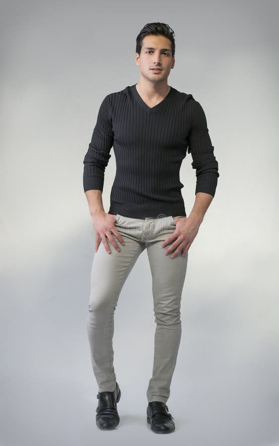 Full Body Photo Of Young Man Standing On Grey Background Stock Photo