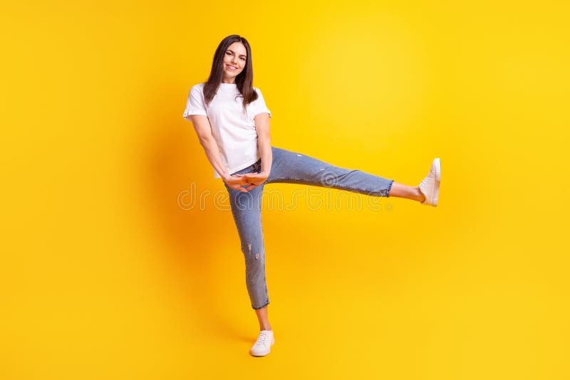 Full body photo of young pretty woman have fun playful dance wear casual outfit isolated over yellow color background royalty free stock photography