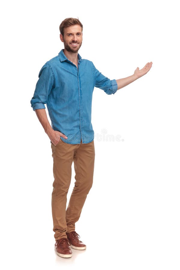 Full body picture of a young casual man presenting