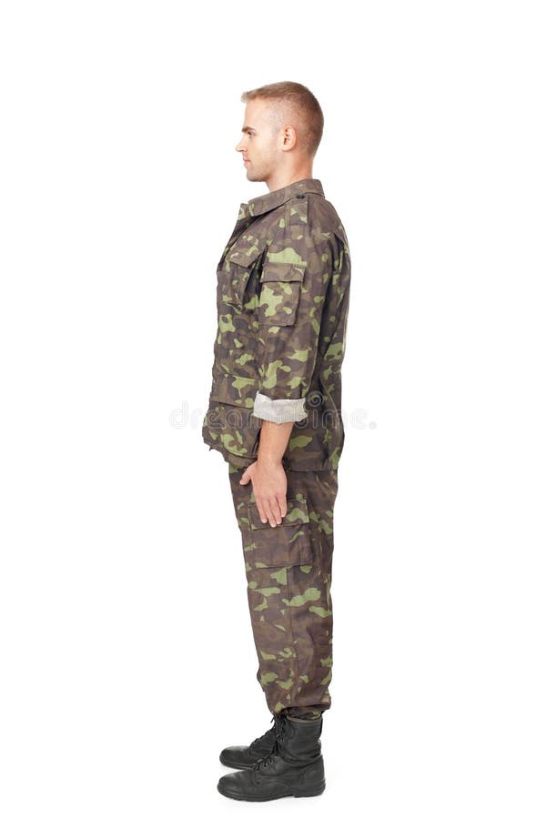 Full body side view of army soldier standing in attention stock photos Full body side view of army soldier standing in attention stock photos