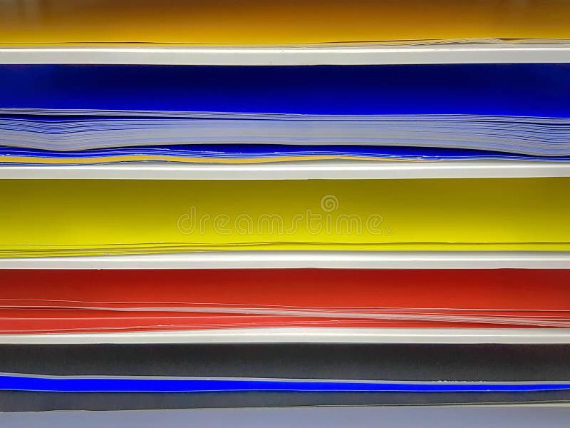 Full Frame Background of Color Papers on Shelf royalty free stock photos